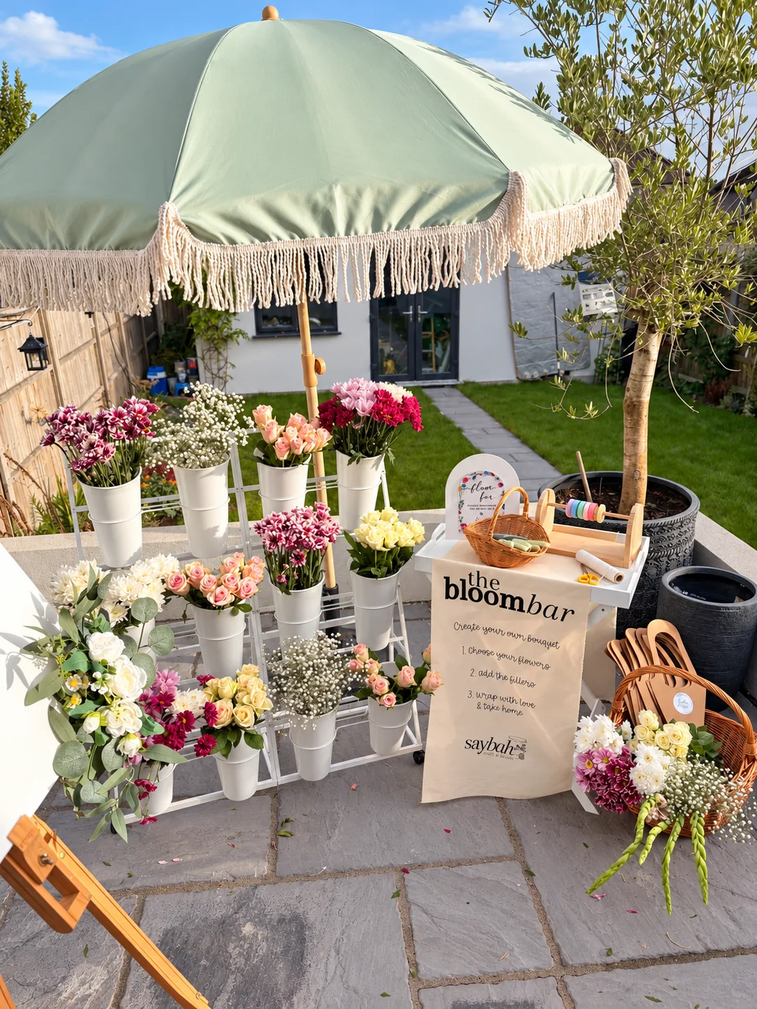Saybah’s Bloom Bar with fresh flowers, bouquet holders and a ribbon table