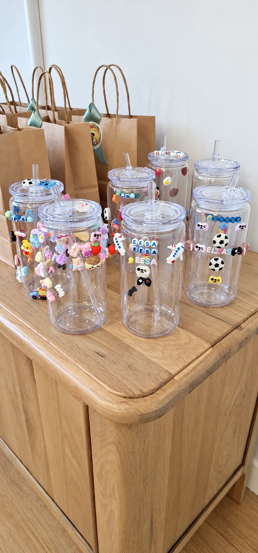 Charm-covered tumblers, each with its own personality