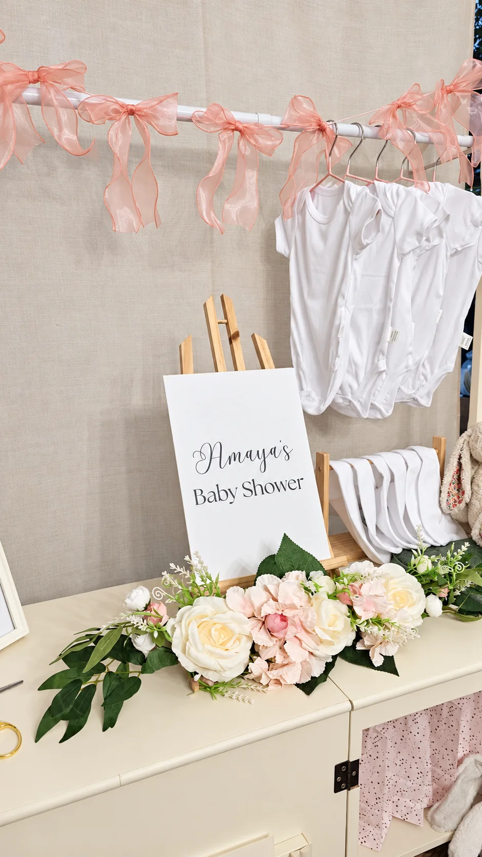 Baby vests, blush bows and flowers at a Saybah Patch Bar baby shower